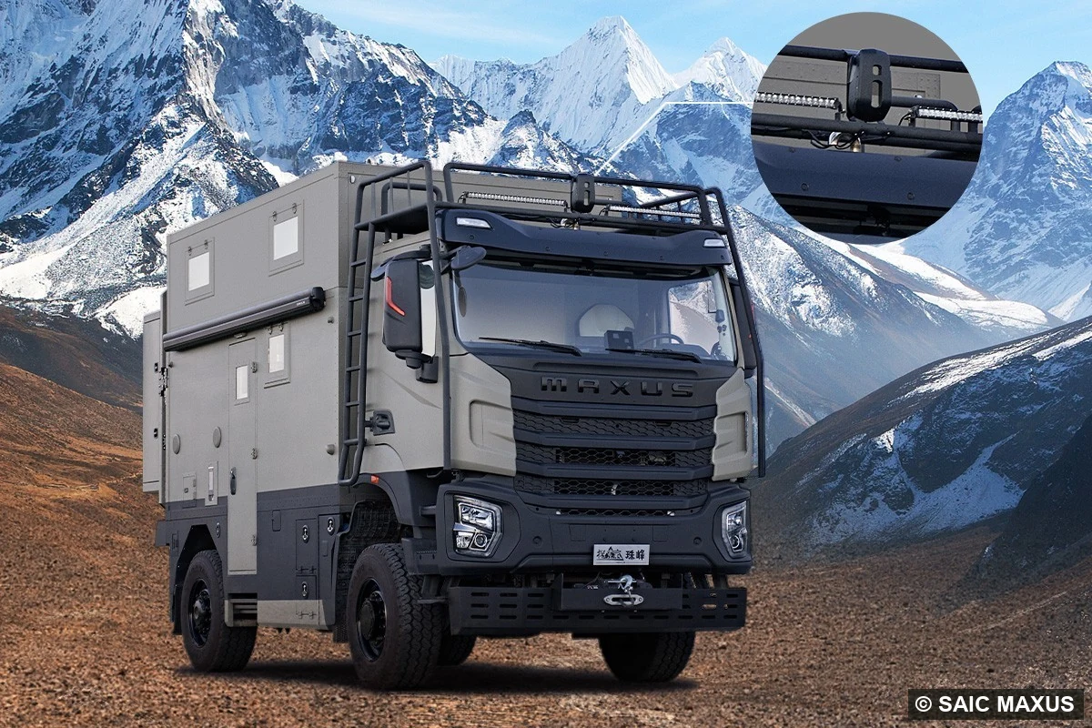 The “mecha” front end — steel bumpers, side skirts, dual 17,000-lb winches, armour-grey paint.