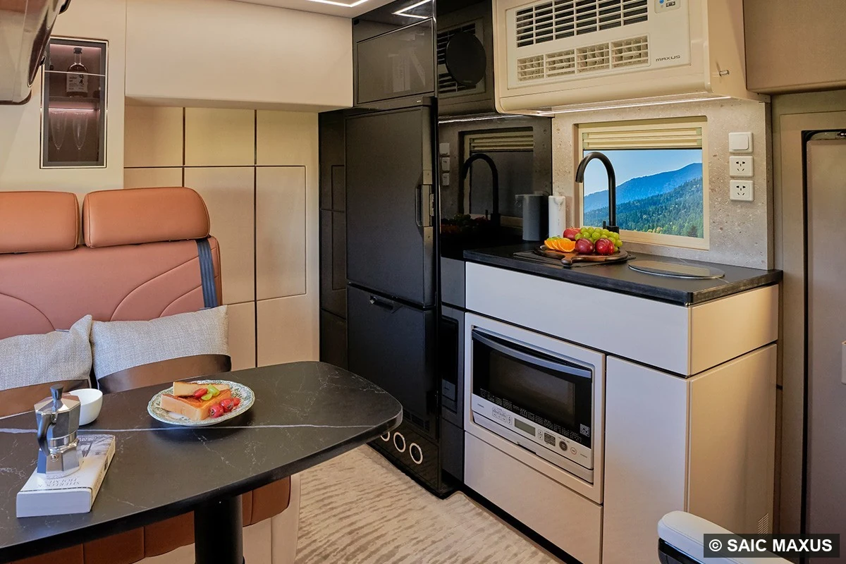 The galley — 174 L fridge, microwave-steam-bake oven, and a proper counter.