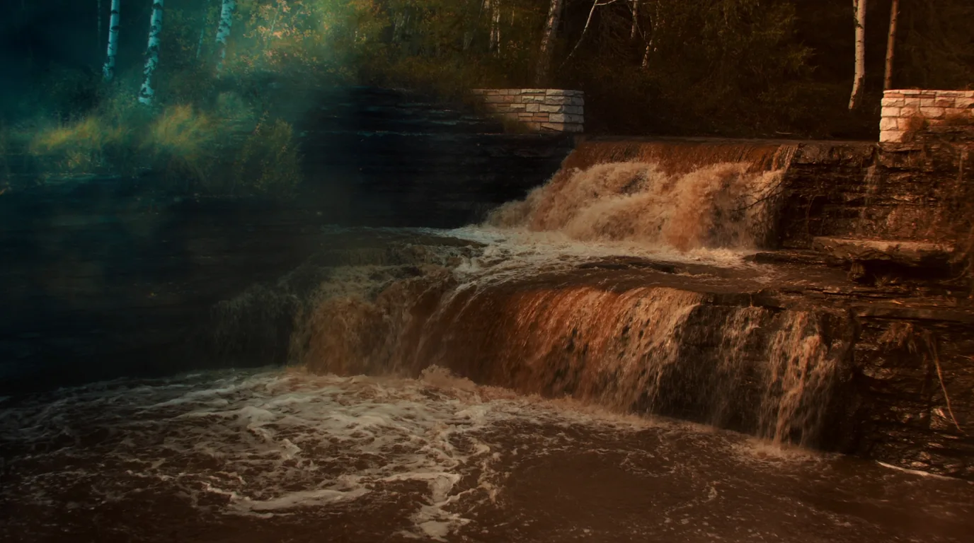 A tiered waterfall stepping down over dark basalt ledges through a forested North Shore river gorge with tannin-brown water and birch above, Minnesota, ultrarealistic photograph representative of the region